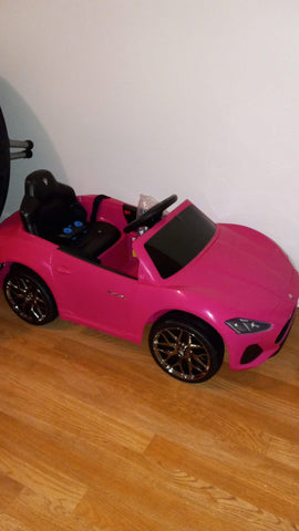 Pink kids Maserati car