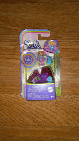 Polly pocket doll with vehicle and hippo